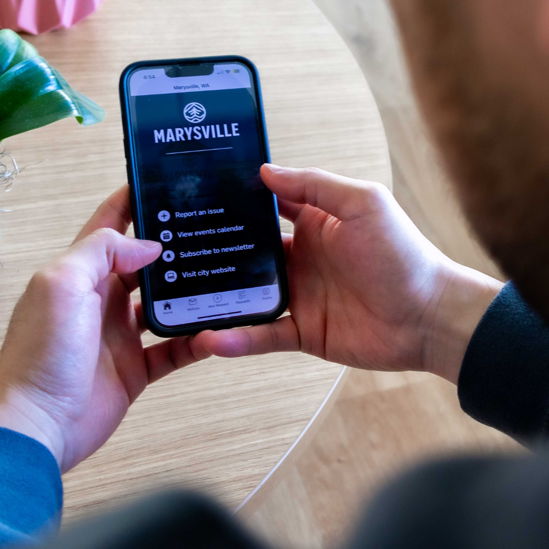 Person looking at My Marysville app on mobile phone